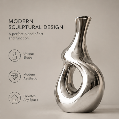 Modern sculptural design full view of mirror silver hollow vase showing unique shape, modern aesthetic, and elevates any space icons