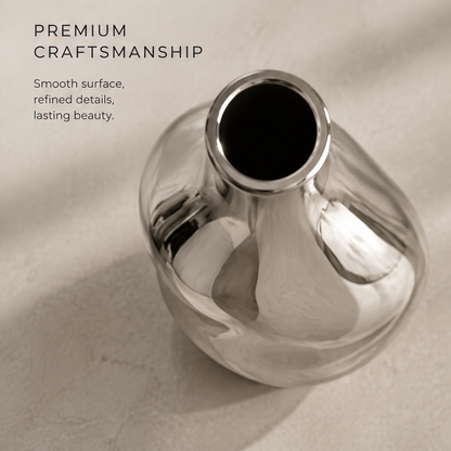 Modern sculptural design silver vase with reflective surface showing sculptural form, luxe finish, and modern home decor icons