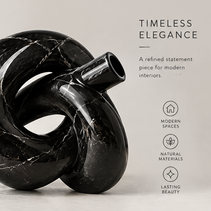 Timeless elegance detail of black marble knot vase showing modern spaces, natural materials, and lasting beauty icons