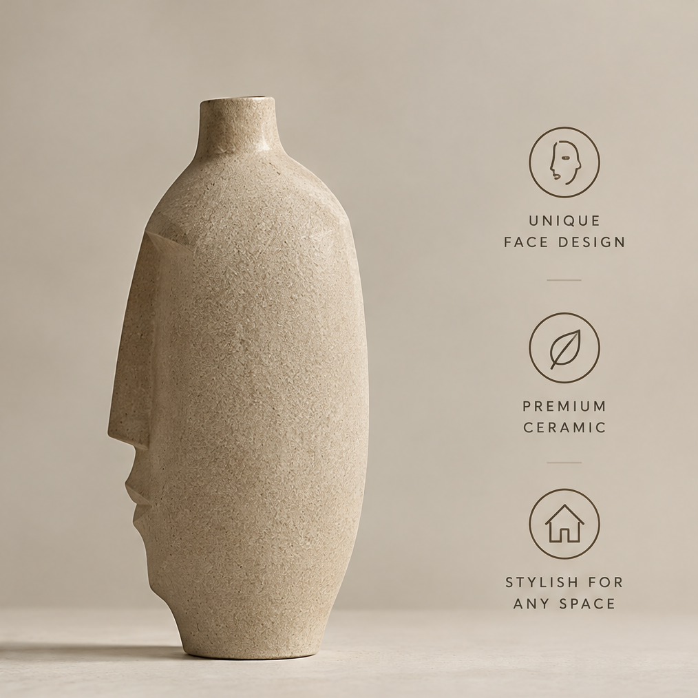 Sandy beige side profile face vase with olive branches displayed on a console table beside a stone sphere and stacked books